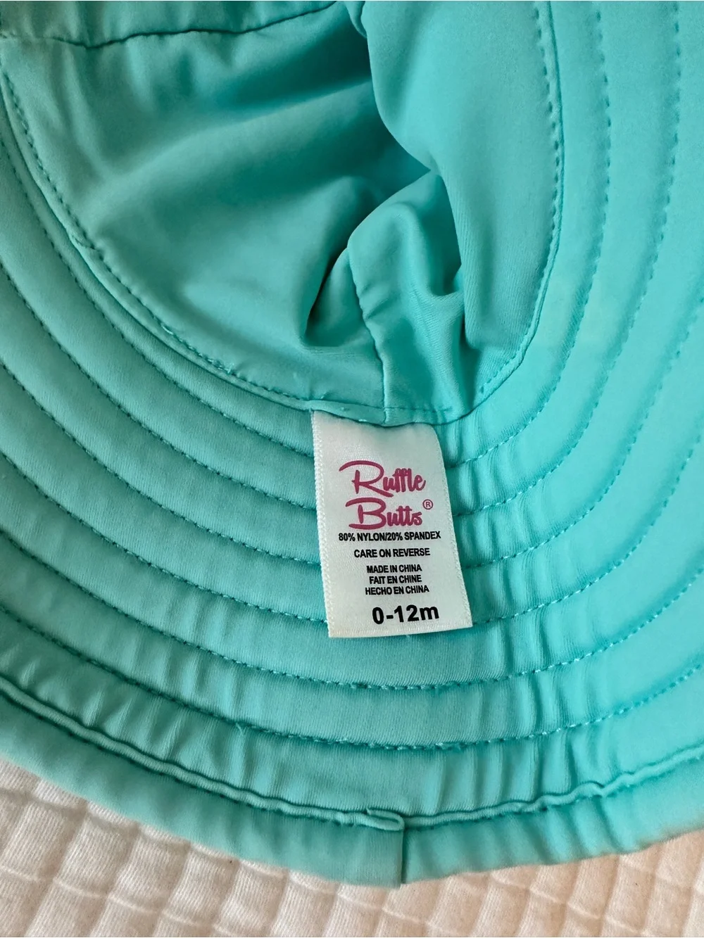 Ruffle Butts Cream Confetti Long Sleeve Rashguard with Teal Hat
